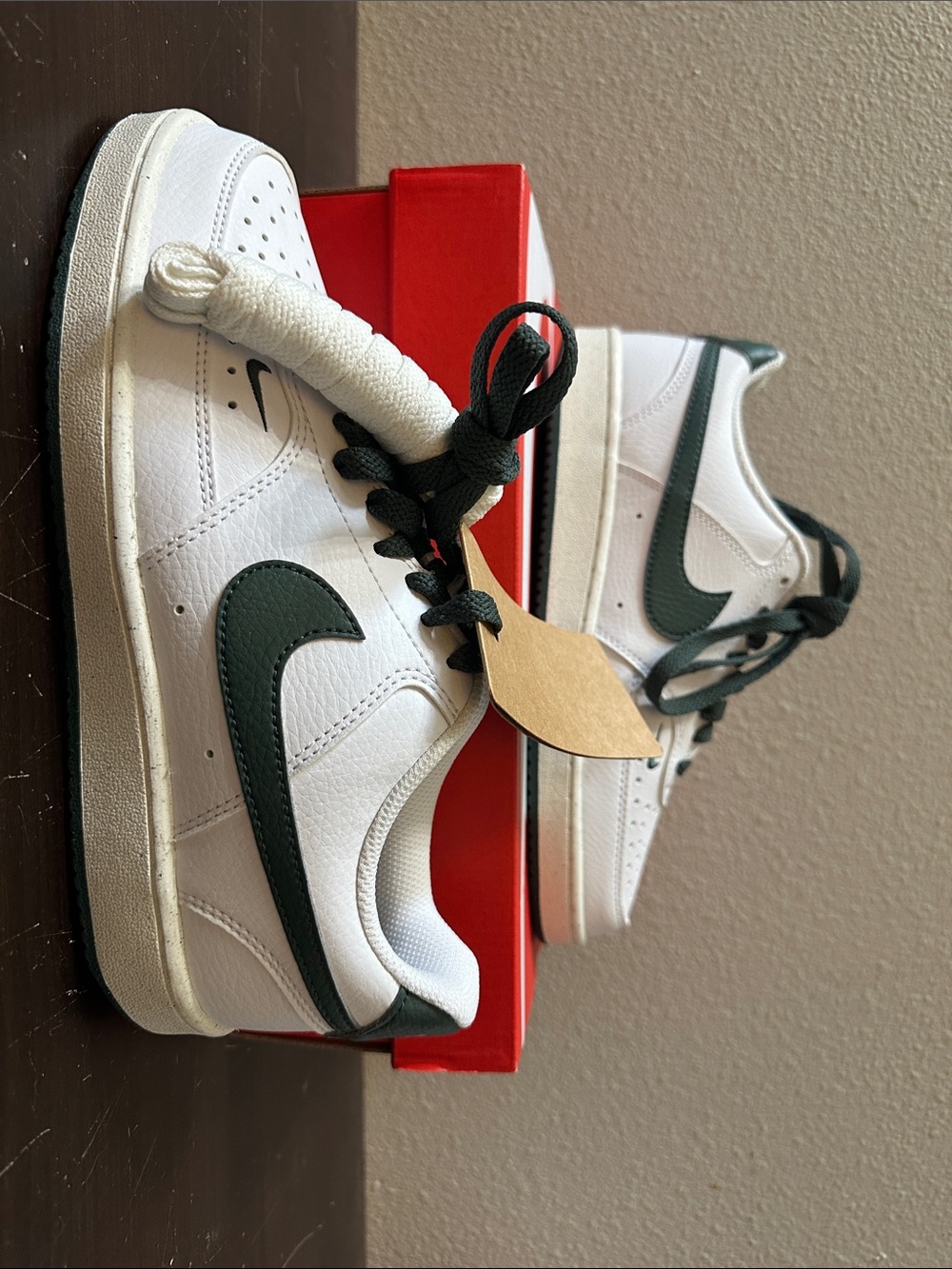 Nike White Low-Top Sneakers with Dark Green Swoosh and Heel